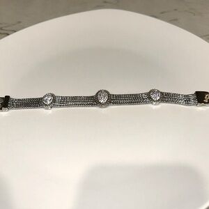 Silver w rhinestone bracelet w magnetic closure.. 5”3/4 long. Med weight.